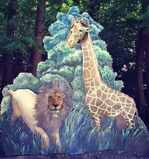 Lion and giraffe on photo.jpg